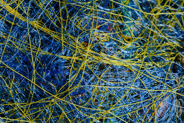 Tangled fishing net, blue and yellow