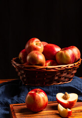 Nectarines in basket and on table. 