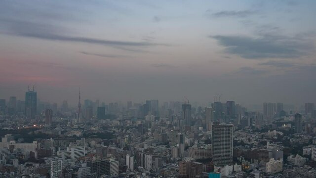 Timelapse video of Tokyo skyscrapers dusk to night with Lunar eclipse.