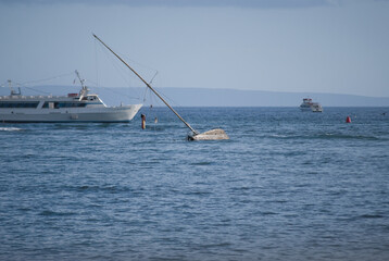 sailing boat sinking in the sea