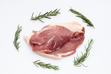 Pork meat with rosemeary on white background.