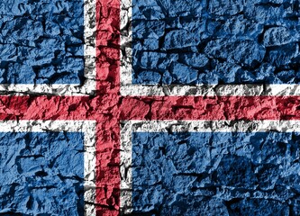 Island flag depicted on a stone wall. The texture of the stone blends perfectly with the colors of...