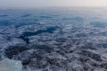 Arctic North Sea. View from above. Ice floes cover the cold sea.