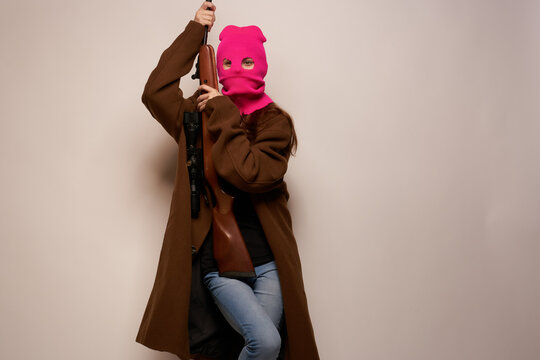 woman in pink mask Glamor Military posing beige background