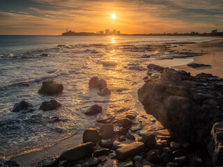 Fototapeta na wymiar Beautiful Seaside Sunrise with Cloud Reflections