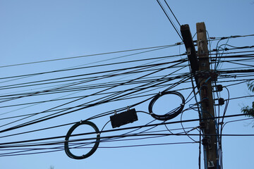 electric pole with electric line on blue sky in thailand style