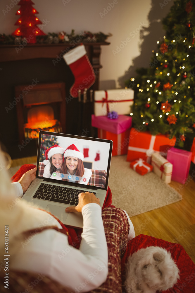 Sticker Santa claus making laptop christmas video call with smiling caucasian mother and daughter