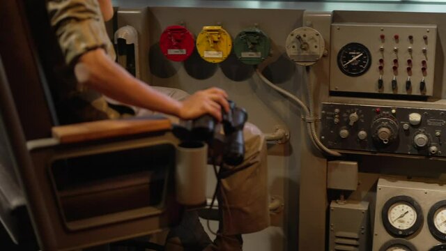This panning video shows old submarine instruments and control panels.