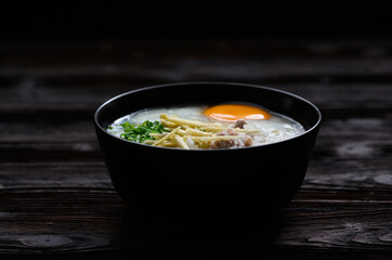 Rice gruel or congee with egg ,pork and vegetable