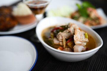Thai food Pork spare rib Spicy soup in white bowl.