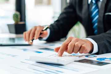 Close up view of bookkeeper or financial inspector hands making report, calculating or checking balance. Home finances, investment, economy, saving money or insurance concept.