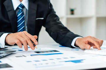 strategy analysis concept, Businessman working financial Manager Researching Process accounting calculate analyse market graph data stock information review on the table in office.