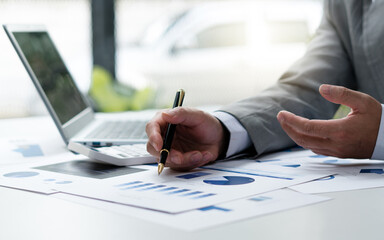 Close up view of bookkeeper or financial inspector hands making report, calculating or checking balance. Home finances, investment, economy, saving money or insurance concept.