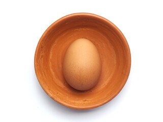 eggs in a clay cup isolated on white background.
