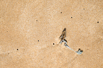 Lost keys in the brown sand