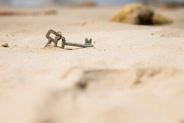 Low angle view of lost keys in sand