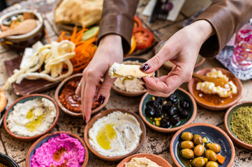 Women eating Traditional Turkish Village Breakfast  served in restaurant. Top view