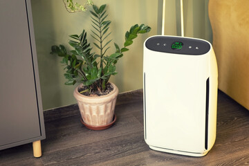 Air purifier inside a living room measuring the breathing quality - 470228628