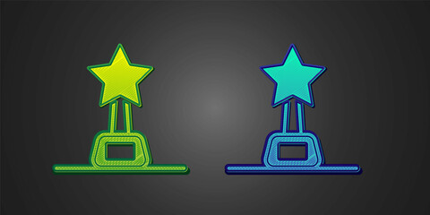 Green and blue Movie trophy icon isolated on black background. Academy award icon. Films and cinema symbol. Vector
