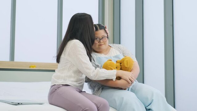 Mother and girl play happily in the bedroom, lots of smiles. vacation time
