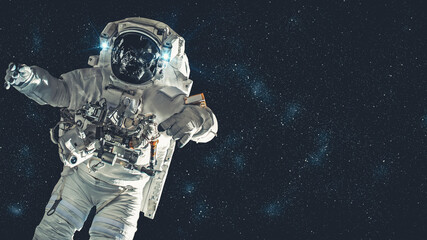 Astronaut spaceman do spacewalk while working for spaceflight mission at space station . Astronaut wear full spacesuit for operation . Elements of this image furnished by NASA space astronaut photos . - obrazy, fototapety, plakaty