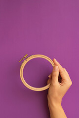 wooden Embroidery ring on a purple background