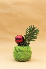 Curly green embroidery thread with purple pearl and green herb inside
