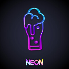 Glowing neon line Glass of beer icon isolated on black background. Vector