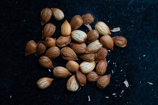 Plum seeds on bacl background