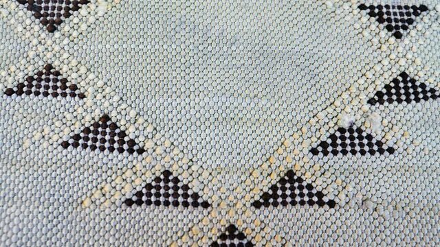 Detail of a handmade, traditional, Moroccan cactus silk (Sabra silk) rug, carpet, in mint green. Macro closeup abstract geometric patterns.