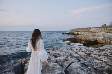 woman traveler enjoying for view of the beautiful sea on her holiday nature