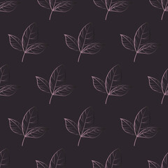 Geometric print on a dark background with leaves