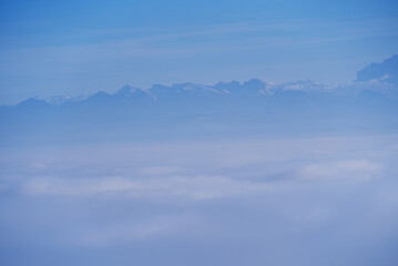 Scenic panorama wit sea of fog seen from local mountain Uetliberg at Canton Zürich on a sunny autumn day. Photo taken November 12th, 2021, Zurich, Switzerland.