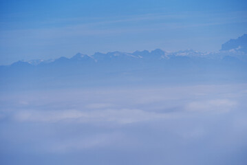 Scenic panorama wit sea of fog seen from local mountain Uetliberg at Canton Zürich on a sunny autumn day. Photo taken November 12th, 2021, Zurich, Switzerland.