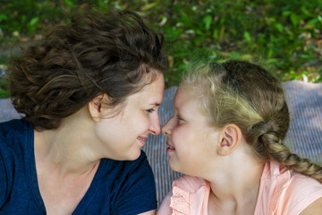 Fototapeta premium Happy mother, daughter. Cheerful woman with the children.