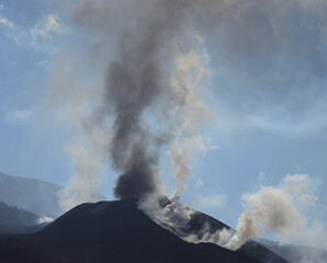 Volcano in full eruption with clouds of ash and steam, island of  La Palma, Canary Islands, Spain
