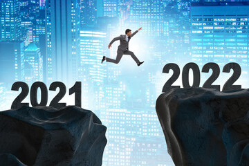 Man jumping from year 2021 to 2022