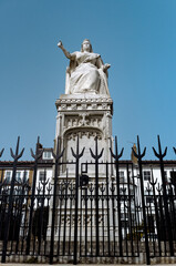 Queen Victoria Statue erected in 1898 to commemorate the Queen's jubilee. The figure of the Queen is enthroned and points towards the sea, Clifftown Parade, Southend-on-Sea, Essex, England
