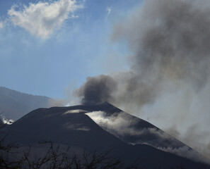 Active volcano with gas clouds and blue sky in the background, Island of La Palma, Spain