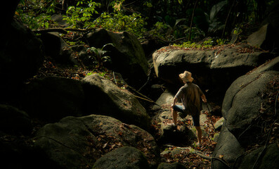 The guy with the hat is exploring the jungle. Travel, adventure, expedition.