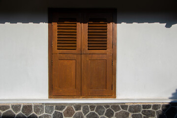 A classic windows. Classic windows in Indonesian Javanese houses made of brown wood
