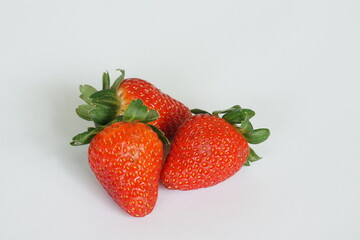red strawberries on the white background