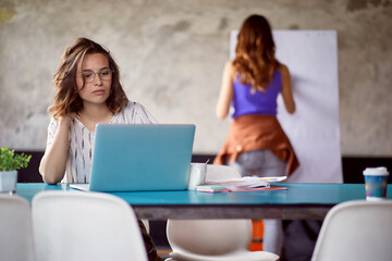 Young female employees are focused on work in the office
