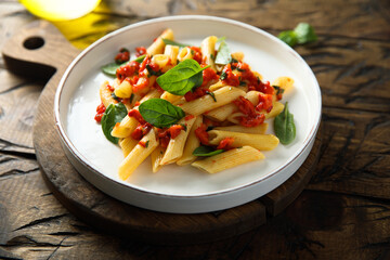 Traditional Italian pasta with tomatoes and basil	