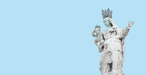 Banner with ancient sculpture of beautiful Venetian Noble Renaissance Era woman with child at Basilica di Santa Maria della Salute in Venice, Italy, at blue sky solid background with copy space.