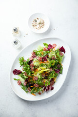 Healthy green salad with sausage
