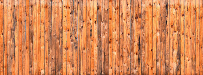 Obraz premium The yellow plank wall is aged naturally.