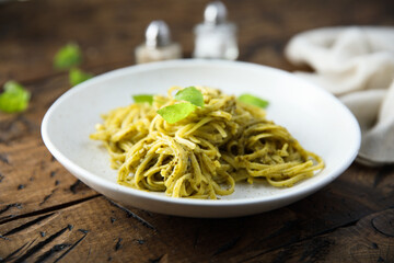 Traditional spaghetti with pesto sauce