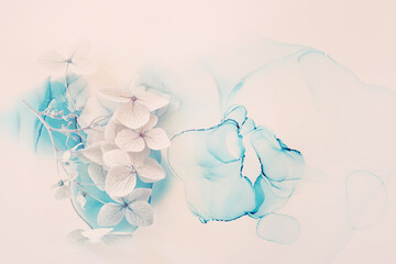 Creative image of pastel blue Hydrangea flowers on artistic ink background. Top view with copy space