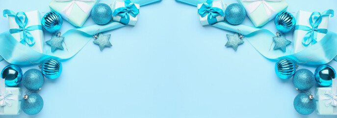 Beautiful Christmas gifts with decor on blue background with space for text